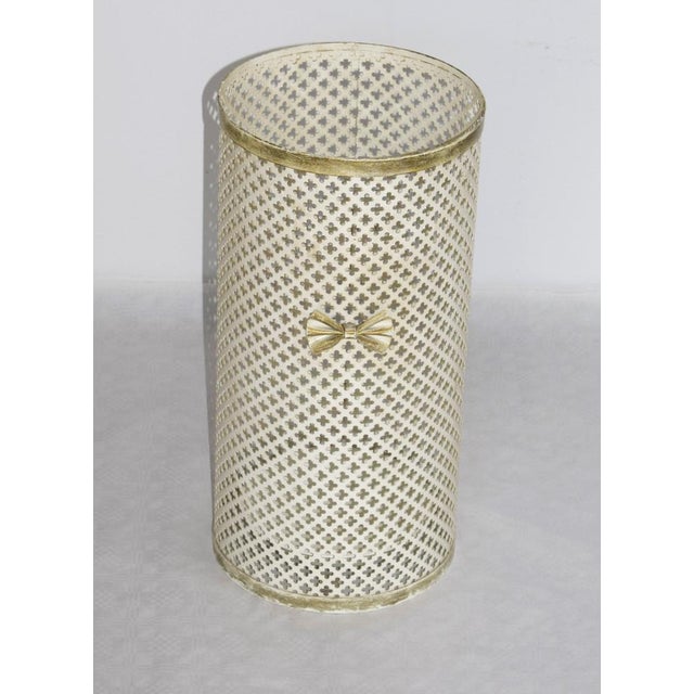 White umbrella stand made of patinated sheet metal. Beautiful patina. Attributed to Mategot. This piece is designed in the...