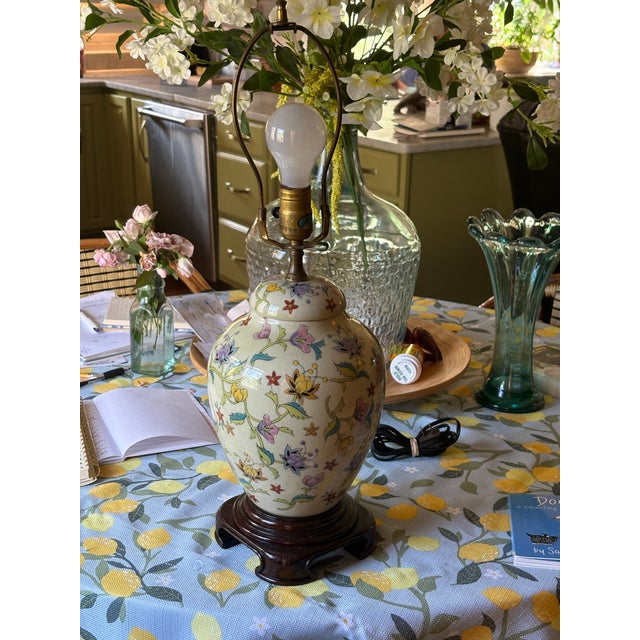 Hand painted floral motif mounted on carved wooden base. Chinese export porcelain. Scrolling vines. Kiln fired over glaze...