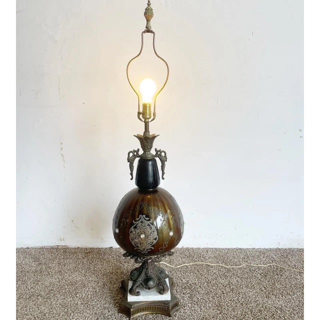 Exquisite antique Italian table lamp. Features porcelain accented with rhinestones with a marble base. 31.5” height to the...