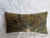 A refined 17th century Flemish tapestry pillow, composed from an antique verdure tapestry fragment depicting a stylized...