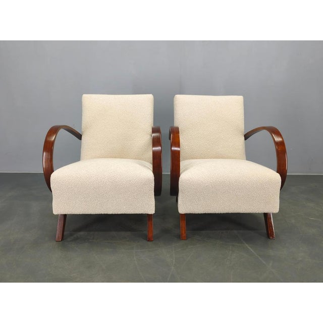 Elegant pair of art deco armchairs designed by jindřich halabala in the 1940s, produced in czechoslovakia. These highly...