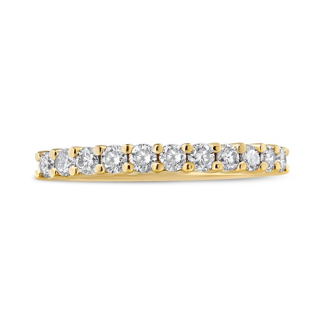 This classic and elegant 2 Micron 14K Yellow Gold Plated Sterling Silver band ring boasts a 1/2 carat of beautiful,...