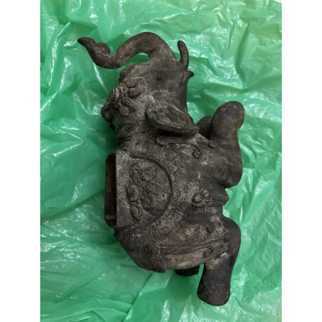 Antique bronze caste iron sculpted elephant incense burner. Elephant is found to be kneeling ceremoniously. Burning...