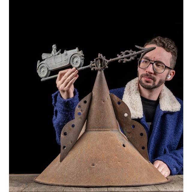 Rustic cupola with attached weathervane. This timeworn piece features a steeple-type peak with punched tin embellishments....