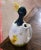 Whimsical in form and richly colored, this antique barbotine pitcher depicts a young duck emerging from a broken eggshell....