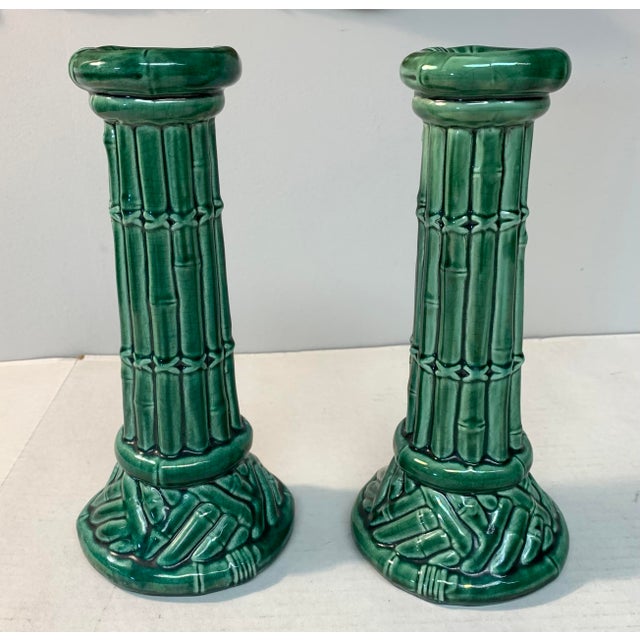 Impressive pair of beefy majolica style ceramic candlesticks with a faux bamboo and lashed pencil split reed motif, plus...