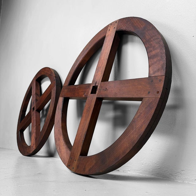 A large Japanese wooden winding wheel, originally part of a traditional itomaki or larger wooden reel used for winding...