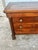A handsome French Empire chest of drawers crafted in the 19th century from richly figured walnut. Featuring three spacious...