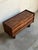 This exceptional low-profile chest displays a streamlined rectangular silhouette supported by substantial slab legs. Four...