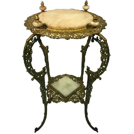 An amazing Art Nouveau two-tier onyx and gilded iron plant stand, circa 90.