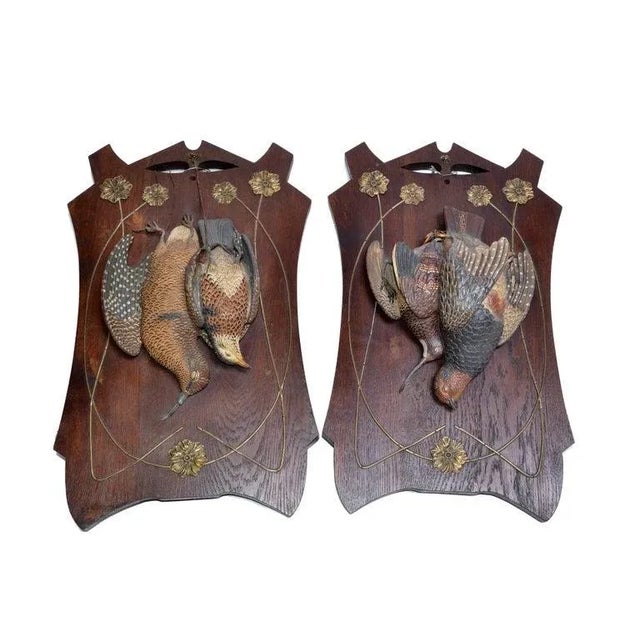 A Pair of Striking Black Forest Terracotta Wall Objects, handmade Pheasant Birds mounted on a solid oak plaque with brass...