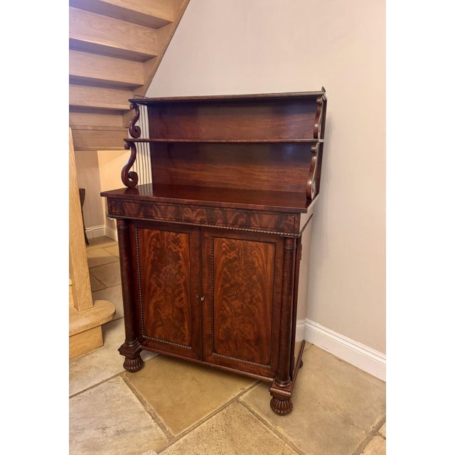Quality antique Regency mahogany chiffonier, having a quality Regency mahogany chiffonier with brass gallery above the...