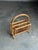 Wonderful modernist magazine rack with great details. Features two sides with a divider. Bamboo frame with reed wrapped...