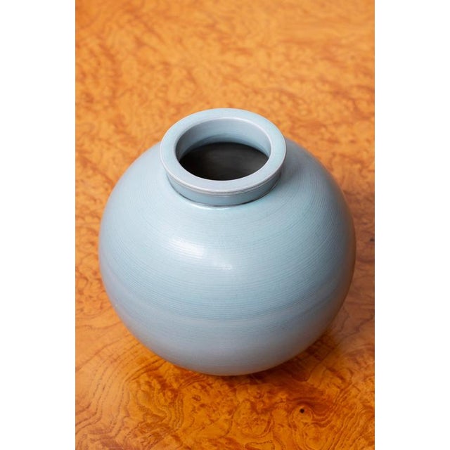 Rare "Aria" vase designed by Wilhelm Kåge. Hand made at Gustavsberg during the 1930s. Light blue striped glaze with hand...
