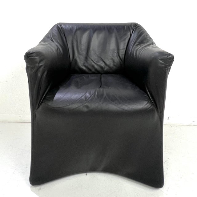 The "Piccola Tentazione" chair, designed by Mario Bellini for Cassina in 1973, embodies Italian modernist elegance with a...
