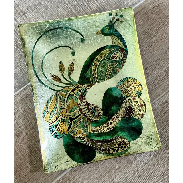 Excellent Pre-Owned Condition. Fabulous reverse painted glass tray featuring a vividly colorful peacock in dusty shades of...