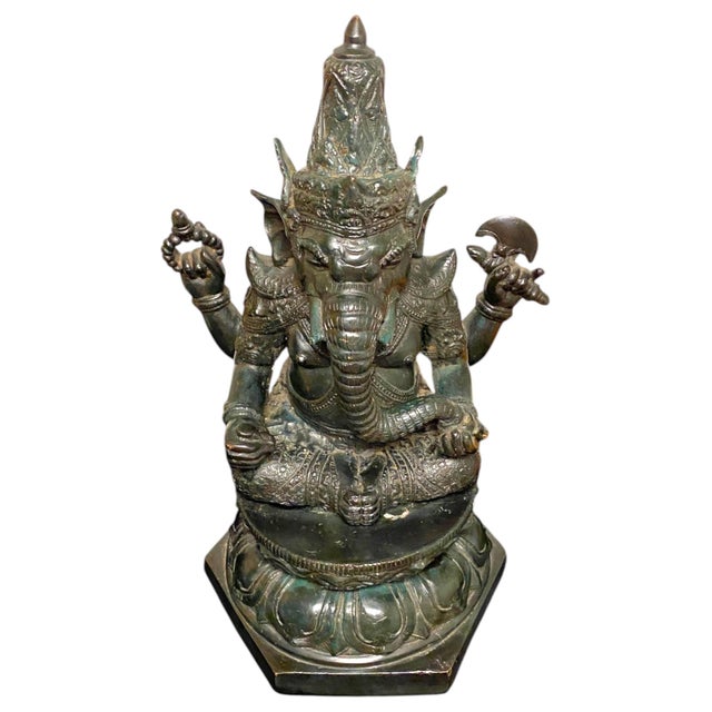 This is a striking bronze Ganesha statue with a beautiful green verdigris patina. Ganesha is universally loved as the...