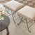 Beautiful iron stools with curved and looped base painted in a matte black finish. Rectangular cushioned seat upholstered...
