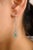 This is part of Chairish’s Fine Jewelry assortment. These modern drop earrings feature striking emeralds encircled by...