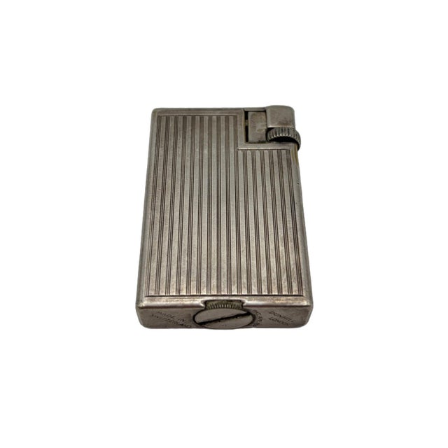 Rare Swiss silver plated Dunhill “Handy” pocket lighter, a highly sought-after larger model with the iconic ribbed finish...