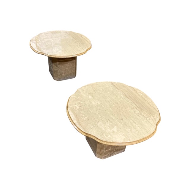 Infuse your space with earthy elegance and sculptural presence through this pair of 1970s Italian travertine scalloped...