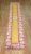 An mid 20th Century bright yellow runner with floral field and medallion. This piece is a one of a kind vintage rug that...
