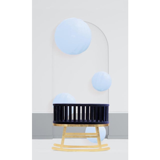 Prince Santi rocking cradle by Royal Stranger Dimensions: 90 x 108 x 65 cm Materials: Blossom velvet over a gold leafed...