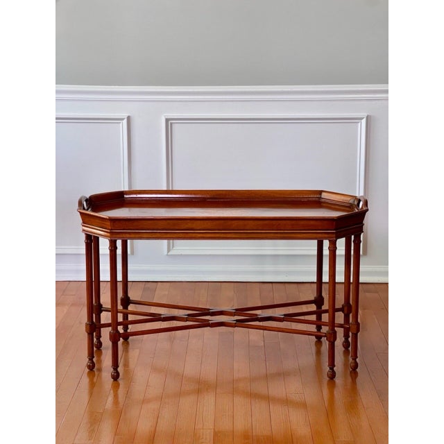 Drexel Heritage tray top style inlaid mahogany cocktail table. Beautiful table featuring a sculpted, octagonal shaped...