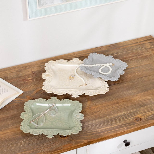 Serve in style with this Ornate Embossed Tray Set, a beautifully detailed trio designed to elevate everyday entertaining....
