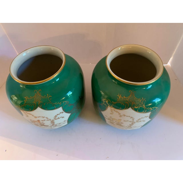 Stunning pair of rare emerald green, white and gold urns by German maker Schwarzenhammer. Rare to see these colors, and to...