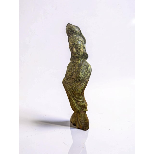This graceful vintage ceramic sculpture depicts Guanyin (Kwan Yin), the Bodhisattva of Compassion, with a beautifully...
