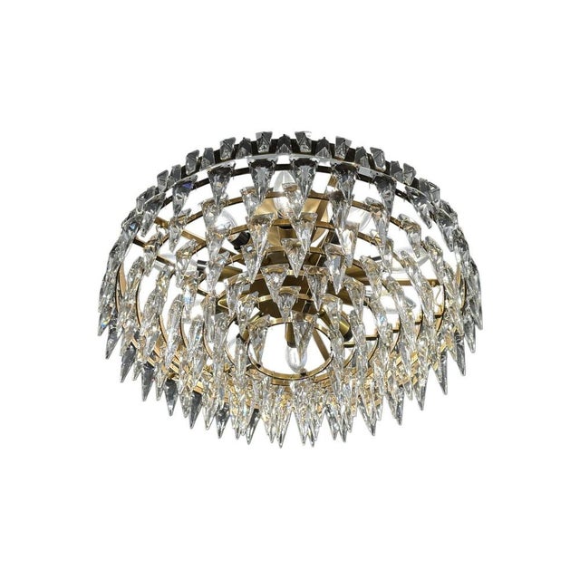 A striking Trillion flush-mount chandelier by Visual Comfort Studio, featuring a radiant arrangement of precision-cut...