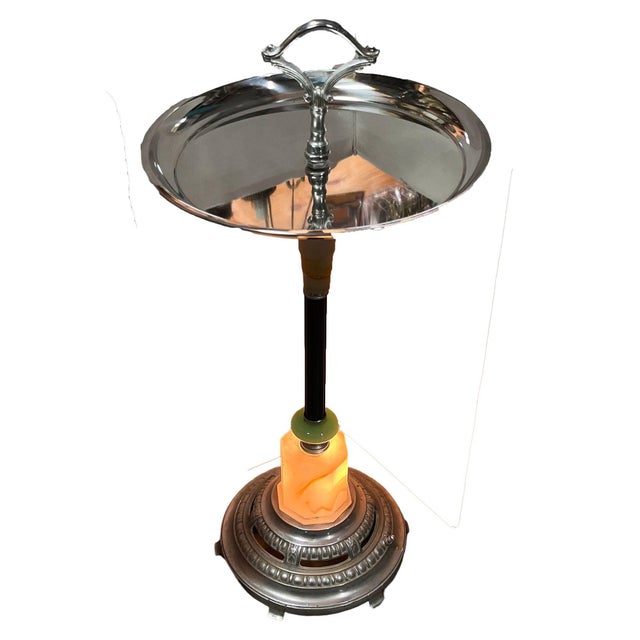 Art Deco chrome round chrome top side drinks table featuring a light-up art glass base. This dual-purpose accent lamp and...