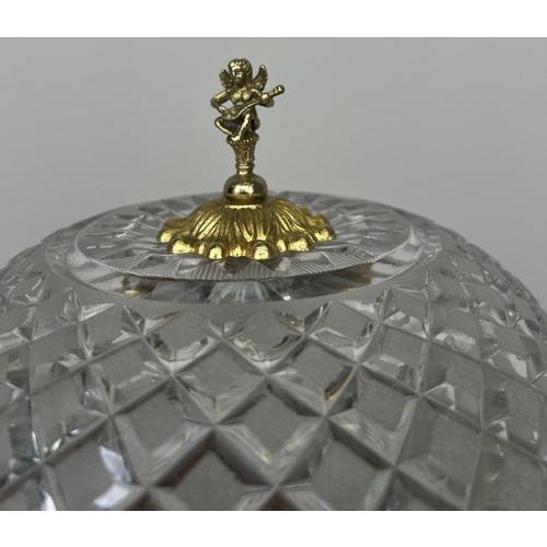 A truly elegant Vintage French crystal lamp, beautifully designed with intricate cut crystal panels and ornate brass...