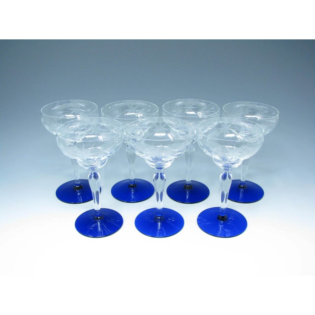 Vintage set of 7 liquor / cocktail glasses or goblets with cut floral design and cobalt foot. These stunning glasses were...