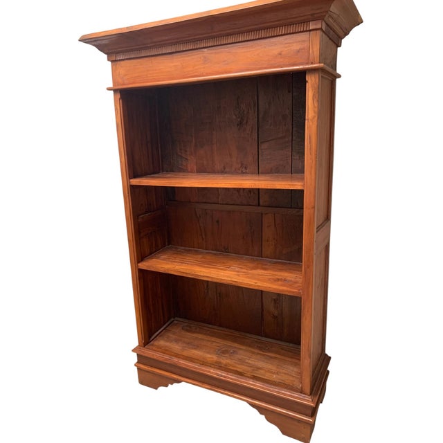 Stunning arts and crafts style solid wood bookcase with reed detailing below the crown molding. The shelves are fixed....