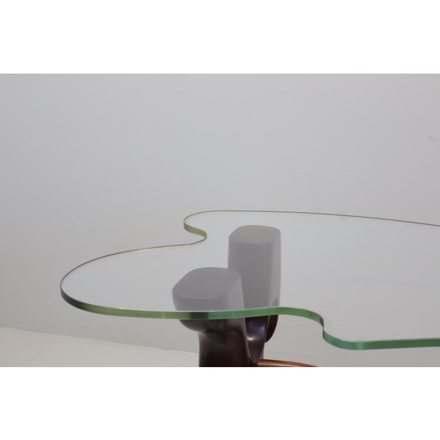 A rare and exceptional console table designed by Paul László in the 1950s. Crafted from richly grained walnut, the...