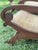 Handcrafted in Indonesia in the mid 20th century, this sculptural pair of teak and cane lounge chairs captures the relaxed...