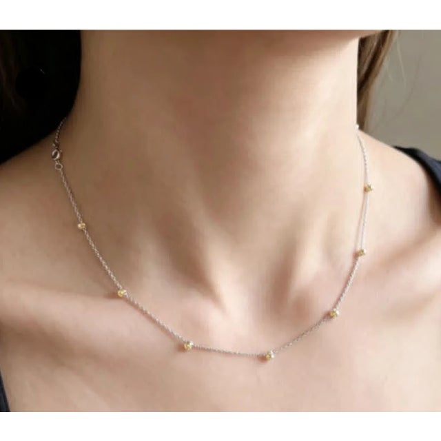 Estate 14K white gold yellow diamond station necklace. This elegant graduating diamonds by the yard style necklace...