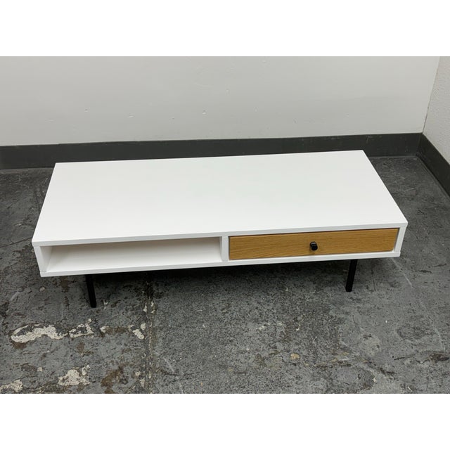 Design Plus Gallery presents a Bios Coffee Table by Article. This low-profile coffee table showcases a white rectangular...