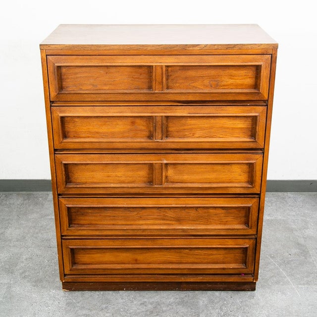 An outstanding Highboy dresser in walnut and walnut veneer by Morris of California. Hard to find style and design. Plenty...