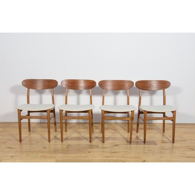 The set of four chairs was manufactured in Denmark in the 1960s. The frame is made of oak. The furniture has undergone a...