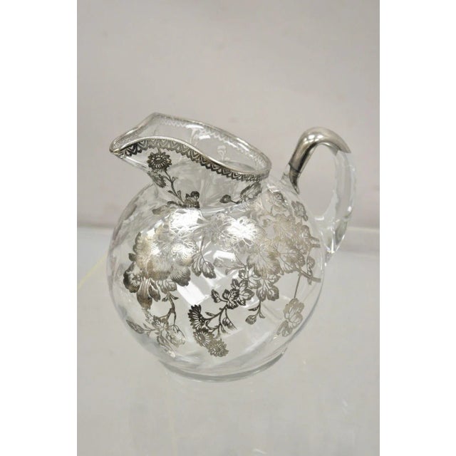 Cambridge Gyro Optic Ball Glass Swirl Water Pitcher w/ Sterling Silver Overlay. Item features swirled blown glass, floral...