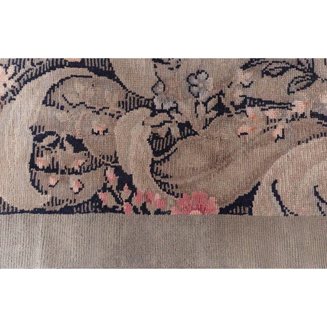 This exquisite antique rug, sourced from Doris Leslie Blau, showcases a rare blend of history and craftsmanship. The...