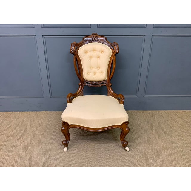 A charming mid Victorian period walnut salon chair. Very well constructed in solid walnut and adorned with crisply carved...
