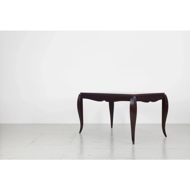 Table made of dark stained rosewood with playfully curved table legs and beautiful details in the elaboration of the table...