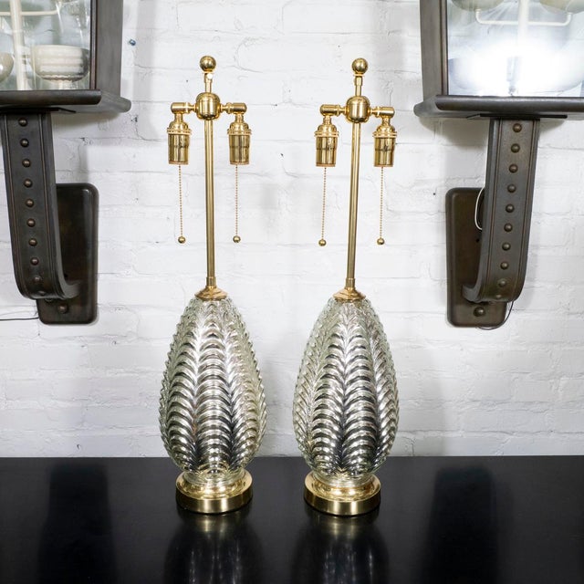 Pair of molded mercury glass table lamps with brass hardware.