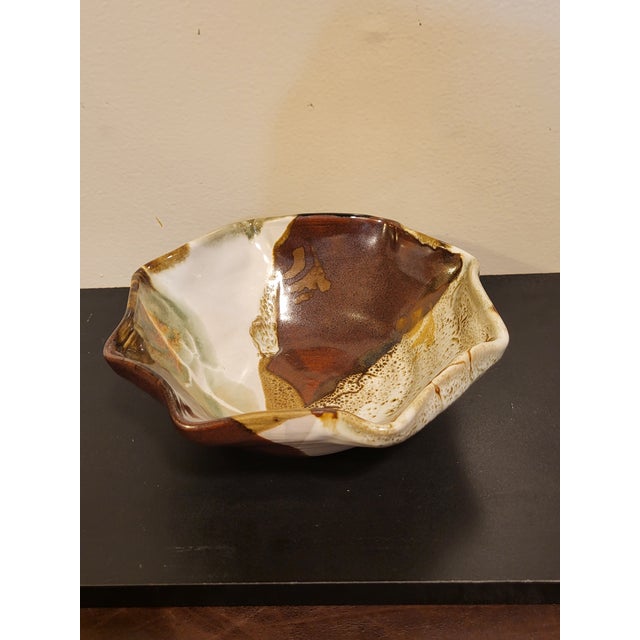 A versitile piece for a table, a dresser, a console, or a display with other artisan studio pottery. An interesting mix of...
