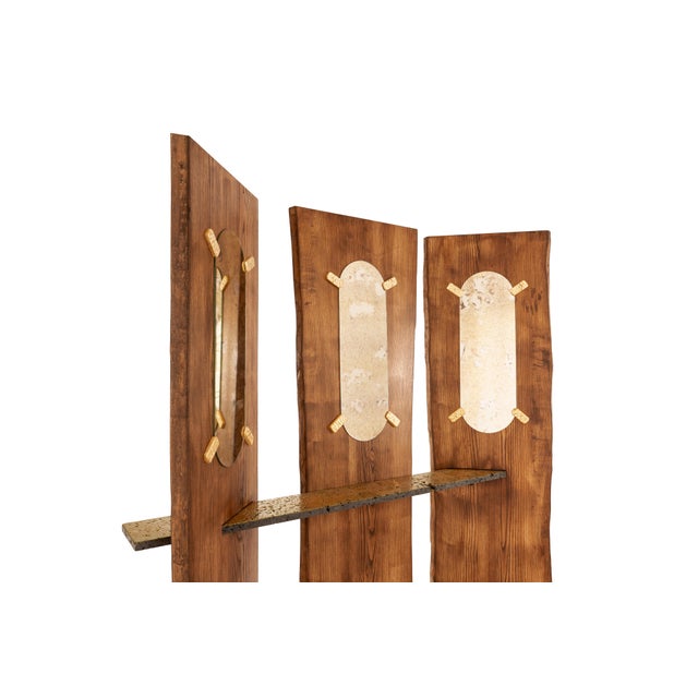 Nessente is a console mirror inspired by Pirandello. Made of solid ash wood, lava stone, metal, 24-karat gold leaf, and an...