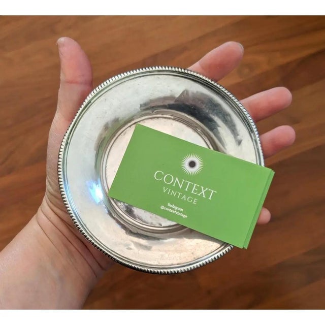 Just a little bit of a historical touch to this mostly modernist feeling shallow trinket dish. It would make a lovely...